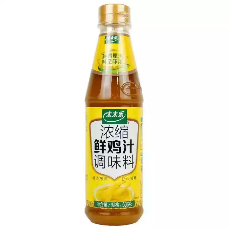 太太乐浓缩鲜鸡汁 536g 挤压瓶正面图，白色瓶身配红色标签