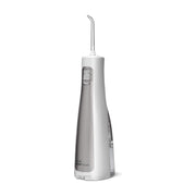 Waterpik 洁碧便携式水牙线标准款，白色机身配灰色面板，侧面视角展示喷嘴和开关按钮。