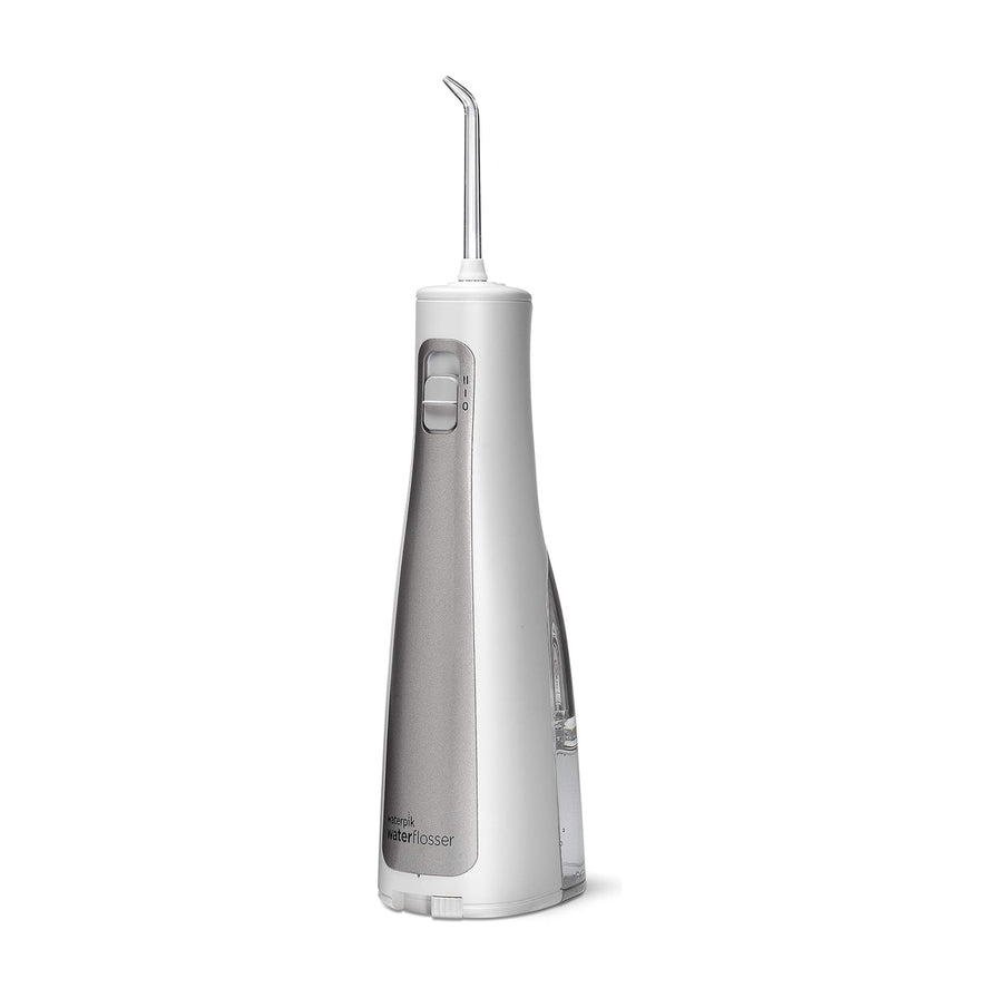 Waterpik 洁碧便携式水牙线标准款，白色机身配灰色面板，侧面视角展示喷嘴和开关按钮。