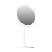 玉瓷白 LED 化妆镜正面展示，7 英寸圆形镜面搭配稳固底座，底部设有触控开关。