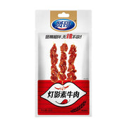 贤哥灯影素牛肉辣条包装正面图，白色袋装，印有三串丝状素牛肉图案，净含量60克。