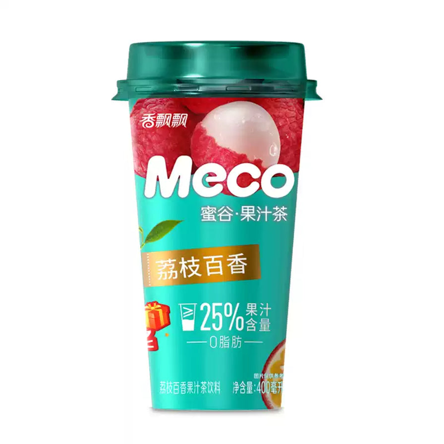 香飘飘Meco蜜谷果汁茶荔枝百香口味，青绿色杯身印有荔枝图案，标注25%果汁含量及0脂肪。