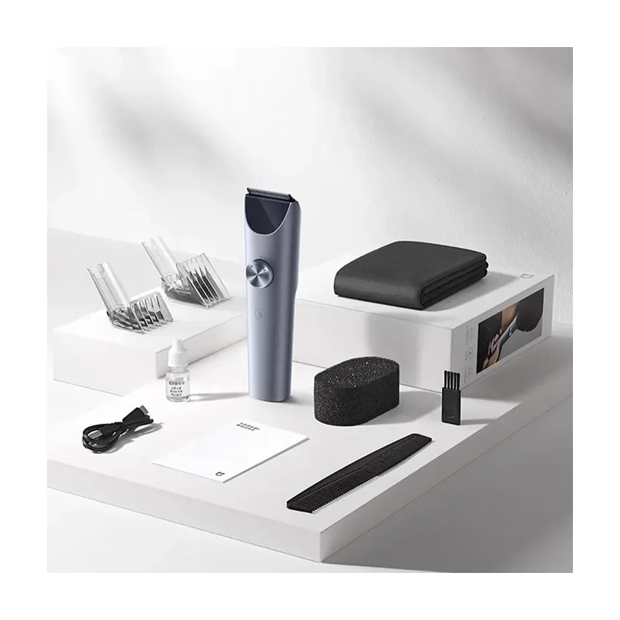 小米米家理发器 1 代产品图，展示灰色机身与全套配件。