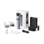 小米米家理发器全家福，包含主机、包装盒、限位梳、收纳包及清洁配件。