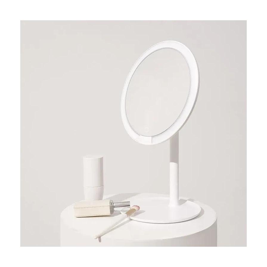 小米米家桌面化妆镜正面展示，白色极简设计搭配圆形镜面与稳固底座。
