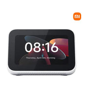 Xiaomi 小米智能家庭屏 Mini 正面视图，白色圆润机身，屏幕显示时间 08:16 及日期，右上角有小米橙色 Logo。