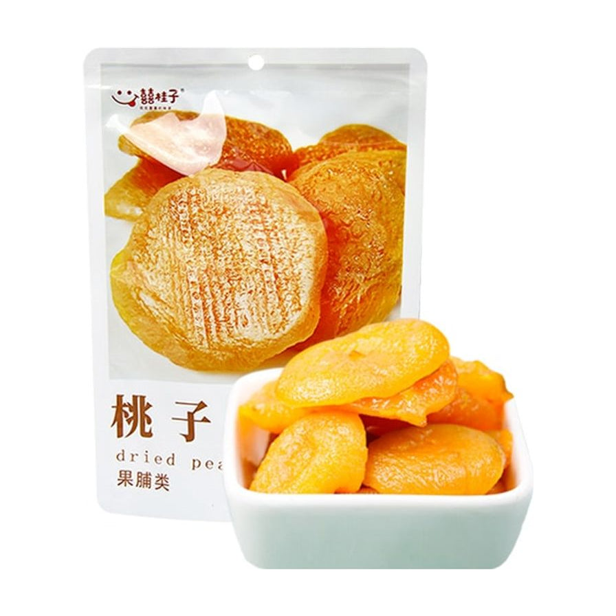 囍桂子桃子干包装袋与一小碗金黄色的厚实桃肉果干。