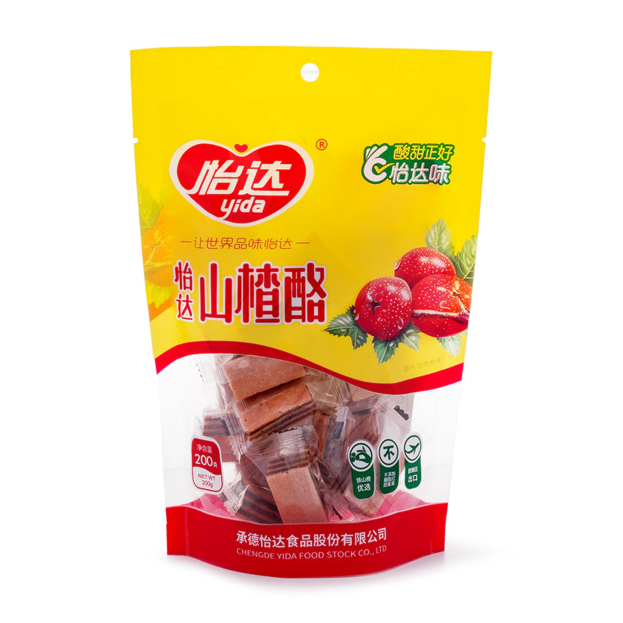 怡达山楂酪黄色包装袋，透明开窗可见内部独立包装的山楂块。
