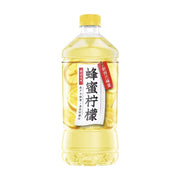 元气森林蜂蜜柠檬水900ml单瓶装，瓶身标签印有蜂蜜柠檬字样及新西兰麦卢卡蜂蜜标识，背景可见柠檬切片图案。