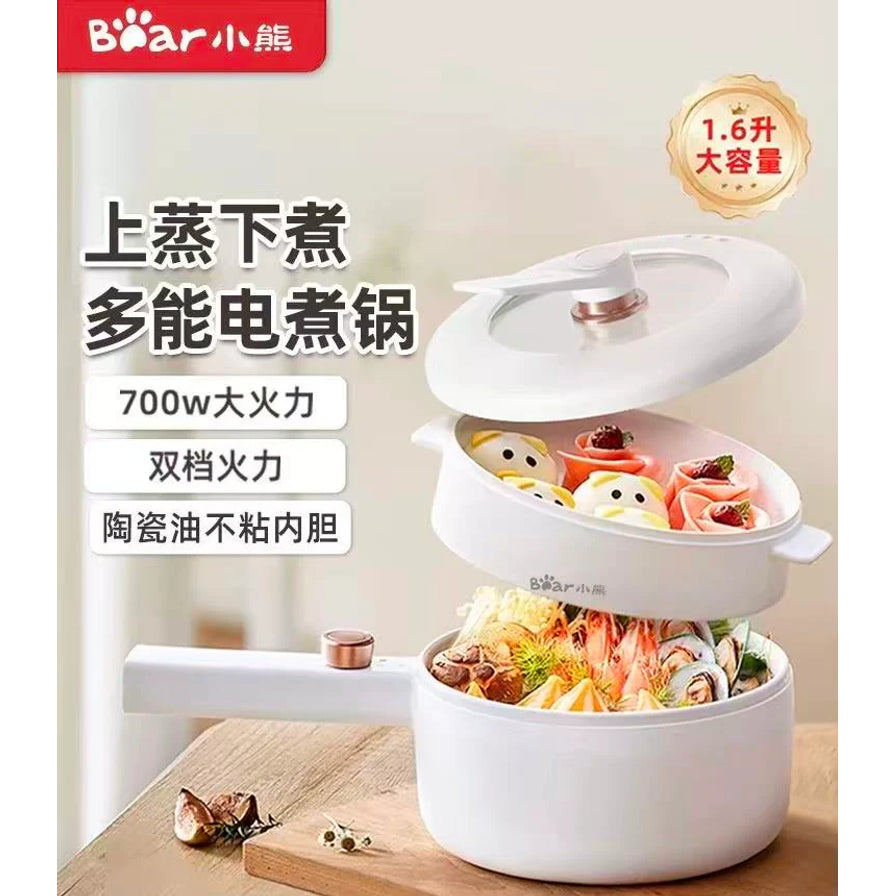 小熊1.6L多功能电煮锅海报，带有上蒸下煮、700W大火力、陶瓷釉不粘内胆等中文卖点文字。