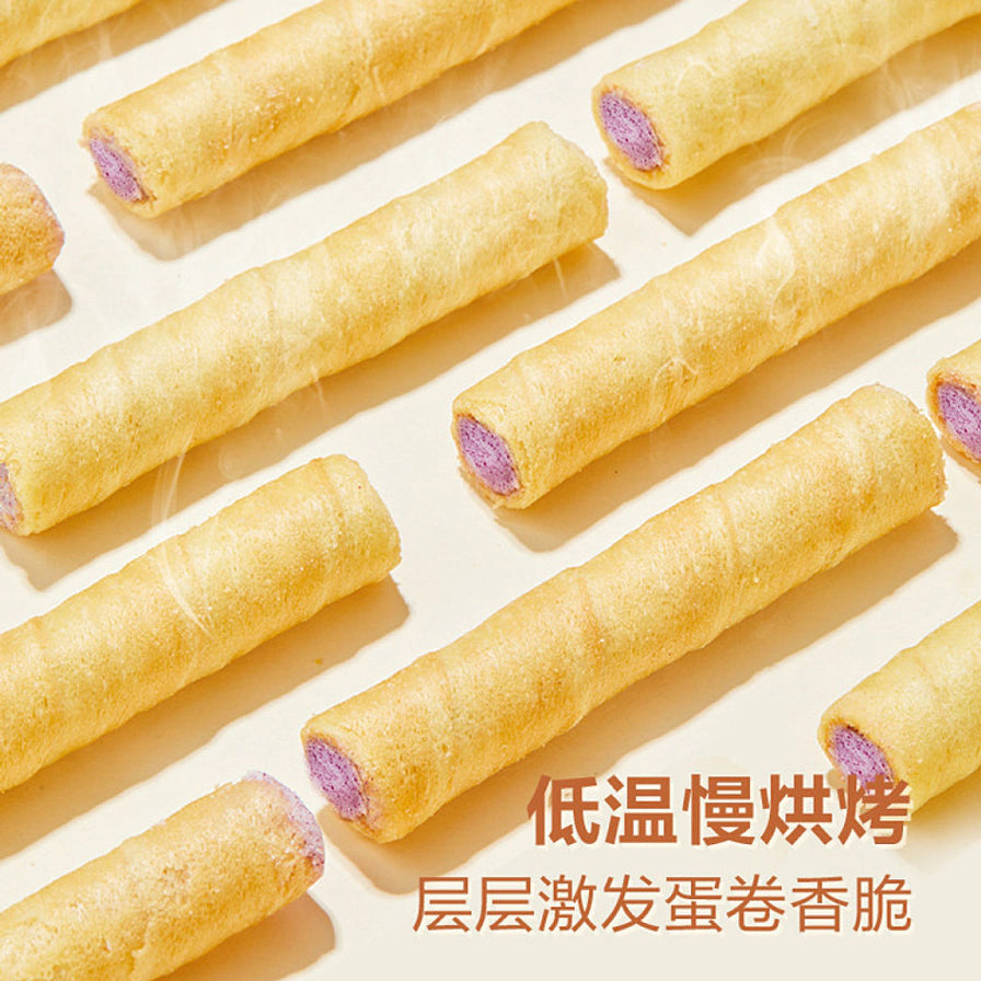 整齐排列的良品铺子香芋注心蛋卷，展示低温烘烤后的金黄酥脆外皮，配有卖点文字。