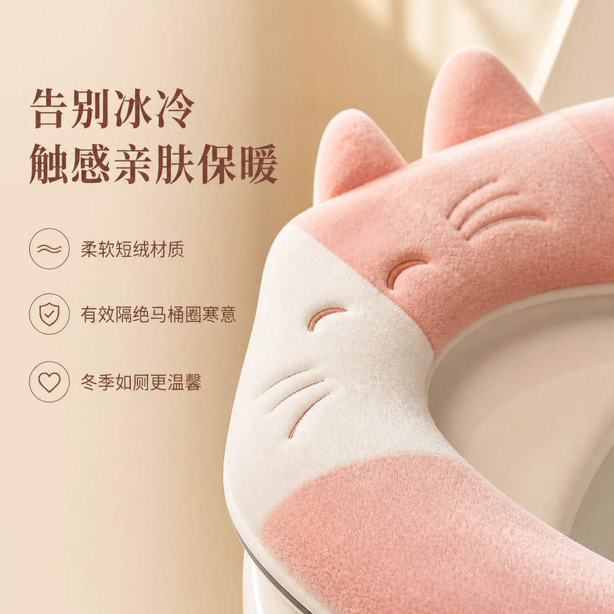 萌猫造型马桶垫细节展示，配有中文说明：告别冰冷、触感亲肤保暖，强调柔软短绒材质。