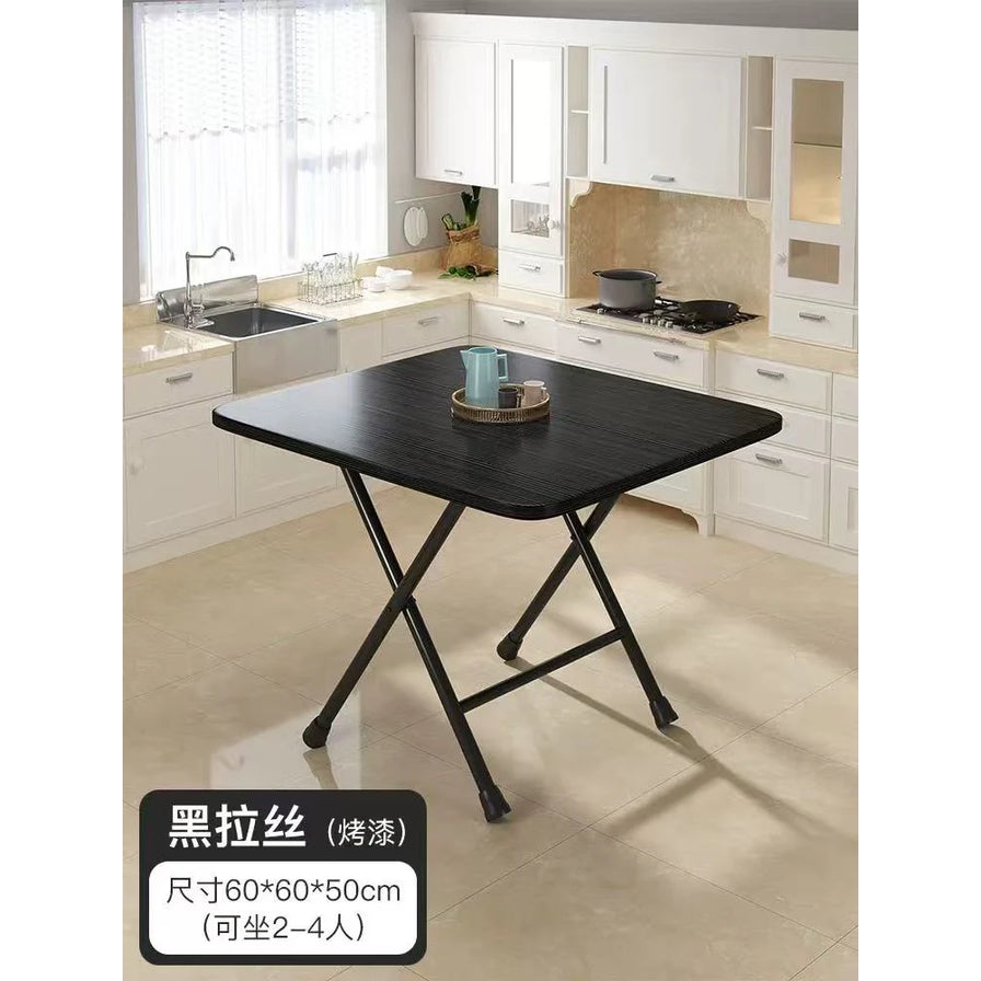 黑色折叠方桌摆放在厨房中，画面左下角有尺寸与颜色中文标注