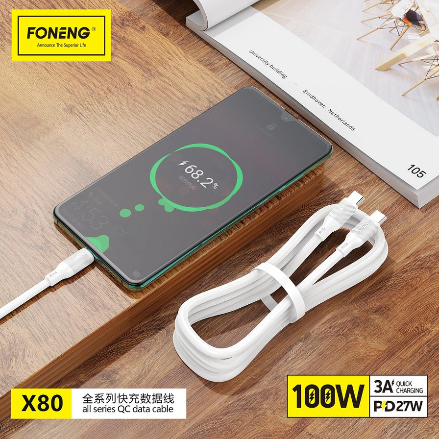 在木纹桌面场景中，FONENG X80 数据线正在为手机充电，屏幕显示超级快充百分比，配有 100W 和全系列快充数据线中文卖点标注。