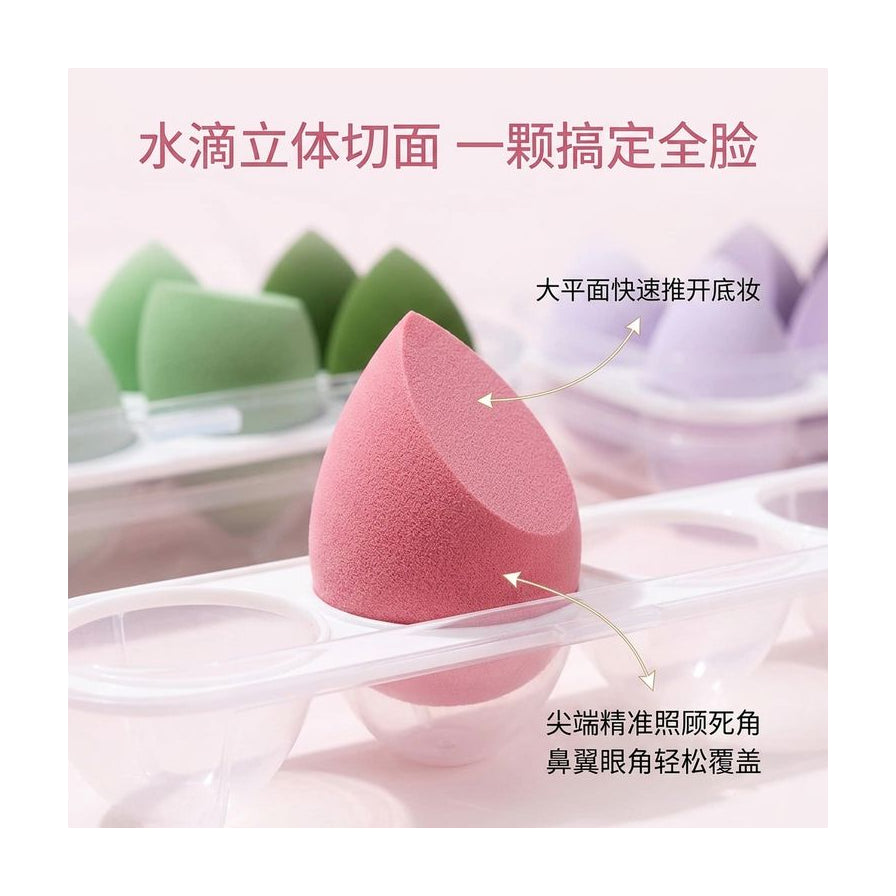 水滴形美妆蛋结构解析图，带有中文箭头标注说明大平面推底妆和尖端照顾死角的用法。