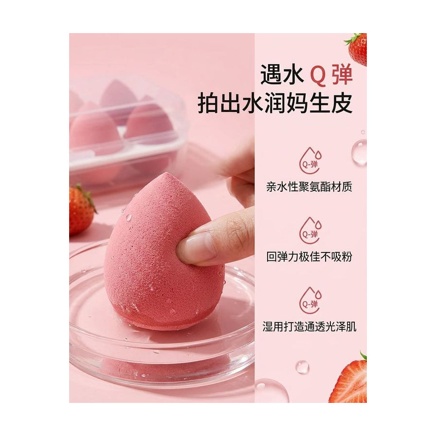 湿润的粉色美妆蛋特写，配有中文说明文字强调遇水 Q 弹、亲水性材质及不吸粉特性。
