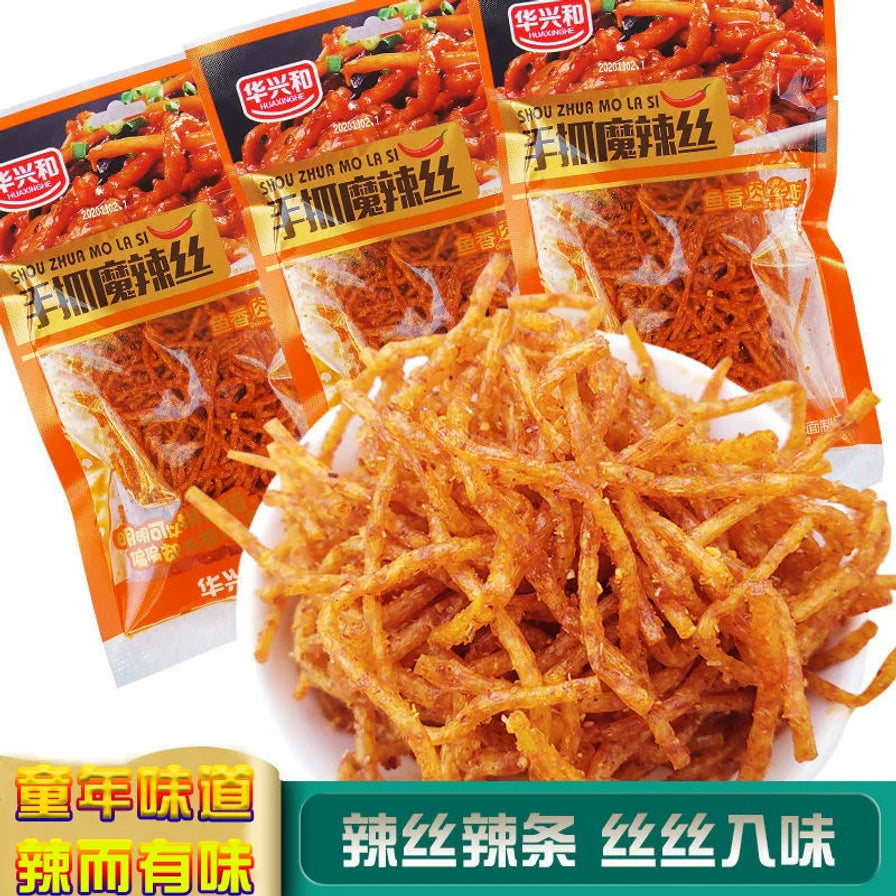 三袋华兴和手抓魔辣丝包装与一碗盛满的辣丝，底部带有童年味道、辣丝辣条等中文促销卖点字样。