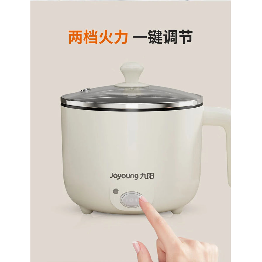 手指按压九阳电热锅开关的特写，上方有“两档火力 一键调节”中文字样。