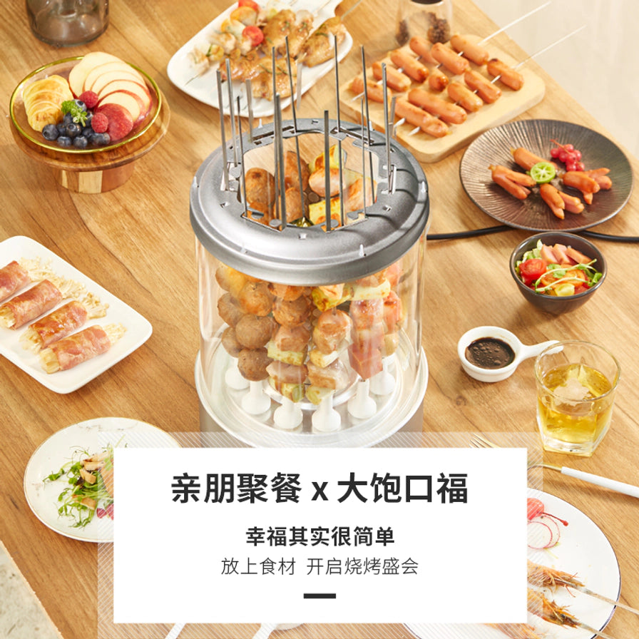 俯拍视角下的利仁电烧烤机，餐桌上摆满了各种烧烤食材，底部带有亲朋聚餐大饱口福的海报文字。