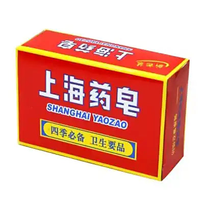 上海药皂红色包装盒正面，印有白色中英文品牌名及黄色标语框。