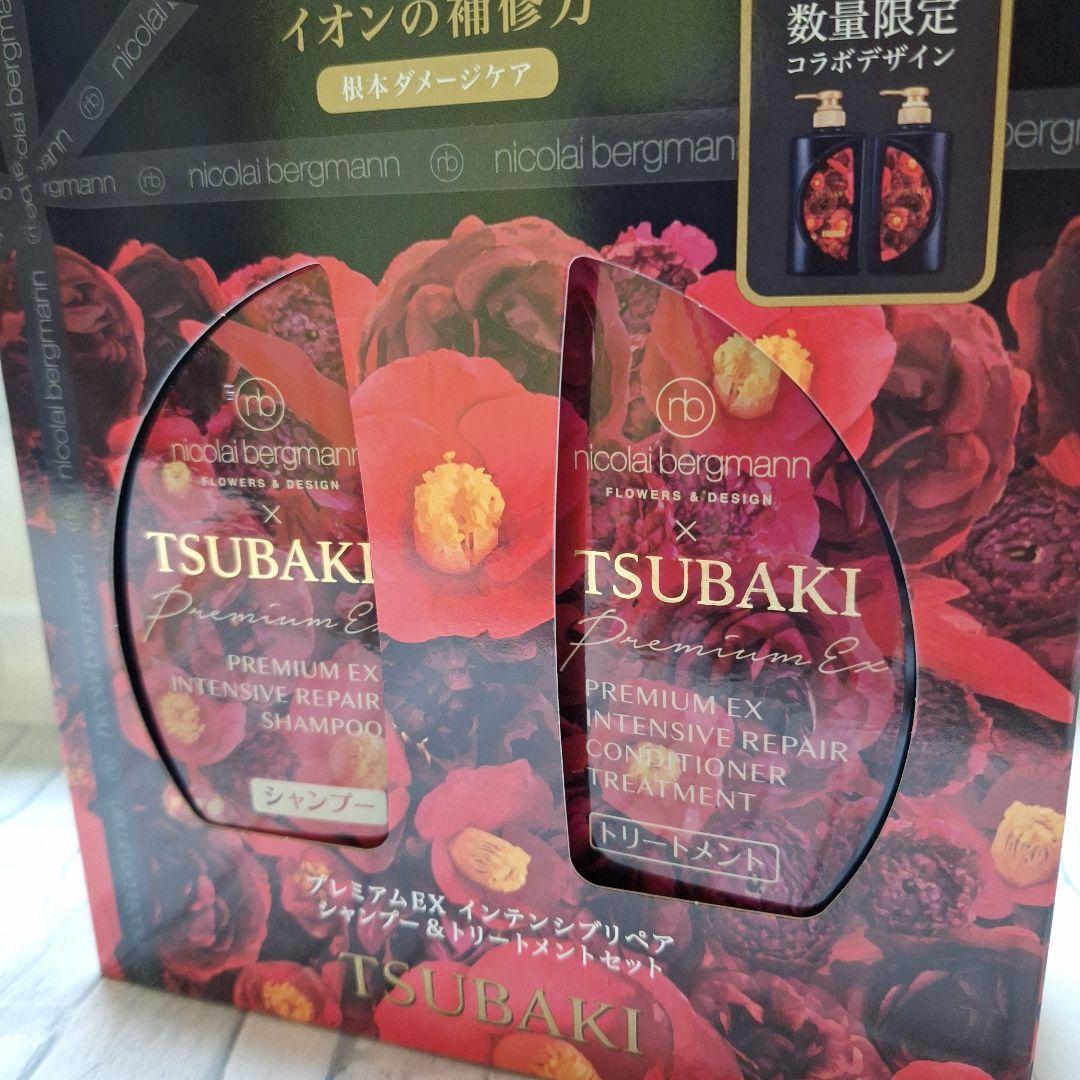 资生堂 TSUBAKI 联名礼盒侧面实拍图，展示透明视窗内的洗发水和护发素瓶身。