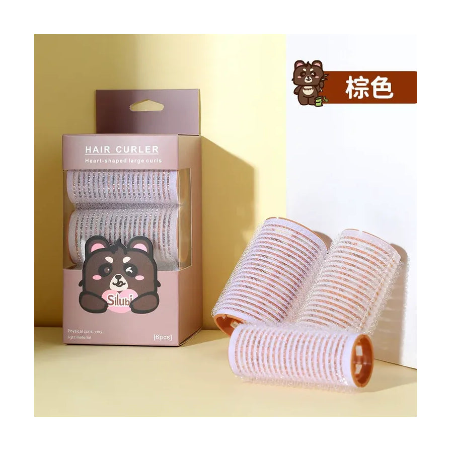 棕色 Silubi 心形卷发器产品场景图，展示包装盒与散落的卷发筒，右上角标有中文“棕色”字样。