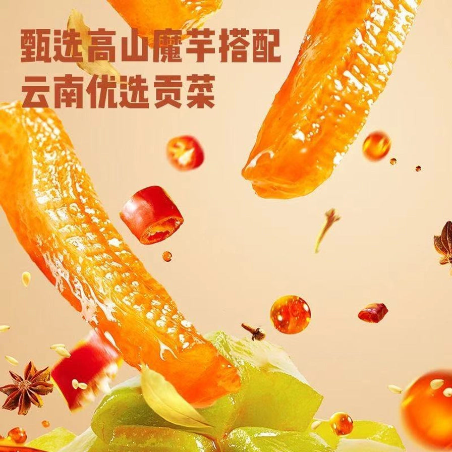 展示飞溅的魔芋贡菜、辣椒和香料，背景文字说明甄选高山魔芋搭配云南优选贡菜。