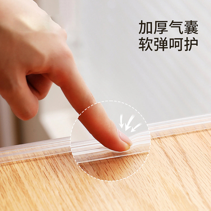 手指按压安装在木质桌边的透明气囊防撞条，展示其加厚气囊的软弹缓冲效果，配有“加厚气囊 软弹呵护”文字。