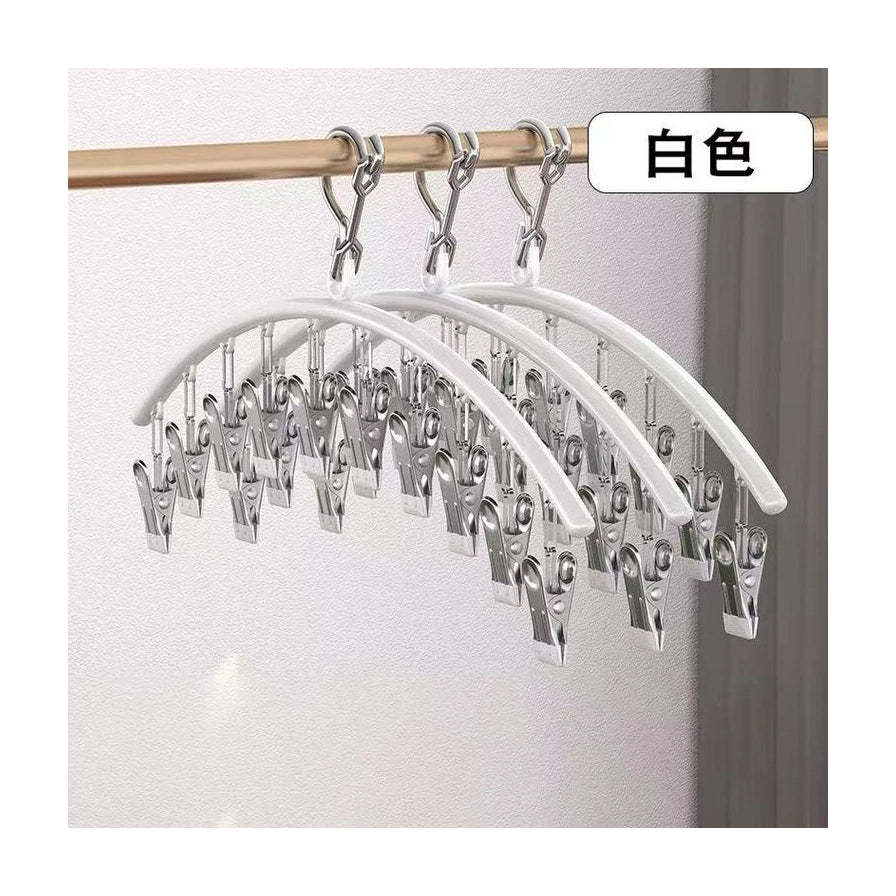 白色弧形袜夹挂在金色晾衣杆上，右上角有“白色”文字标签，展示实际悬挂效果。